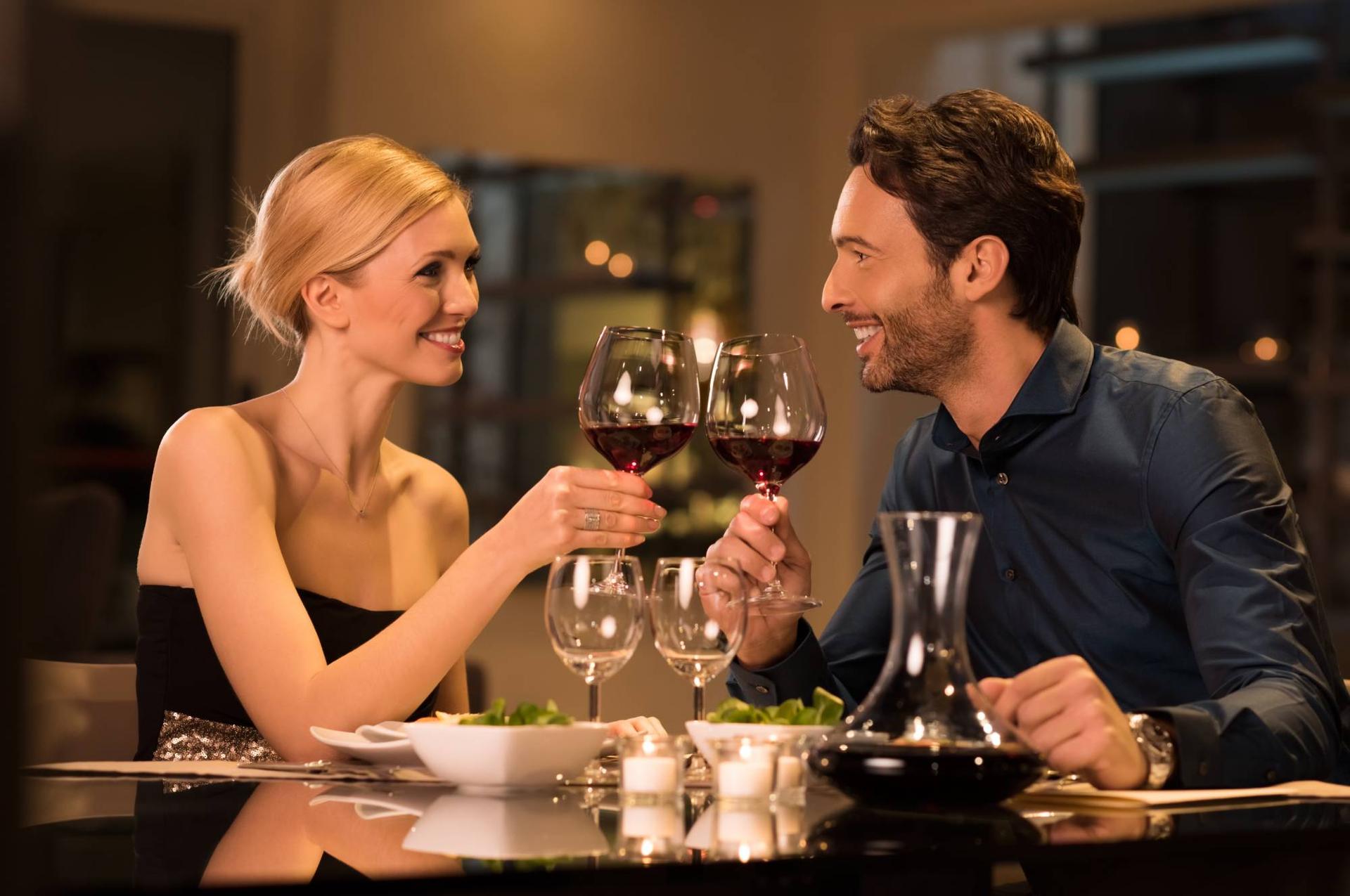 couple having a nice meal and wine at a local restaurant